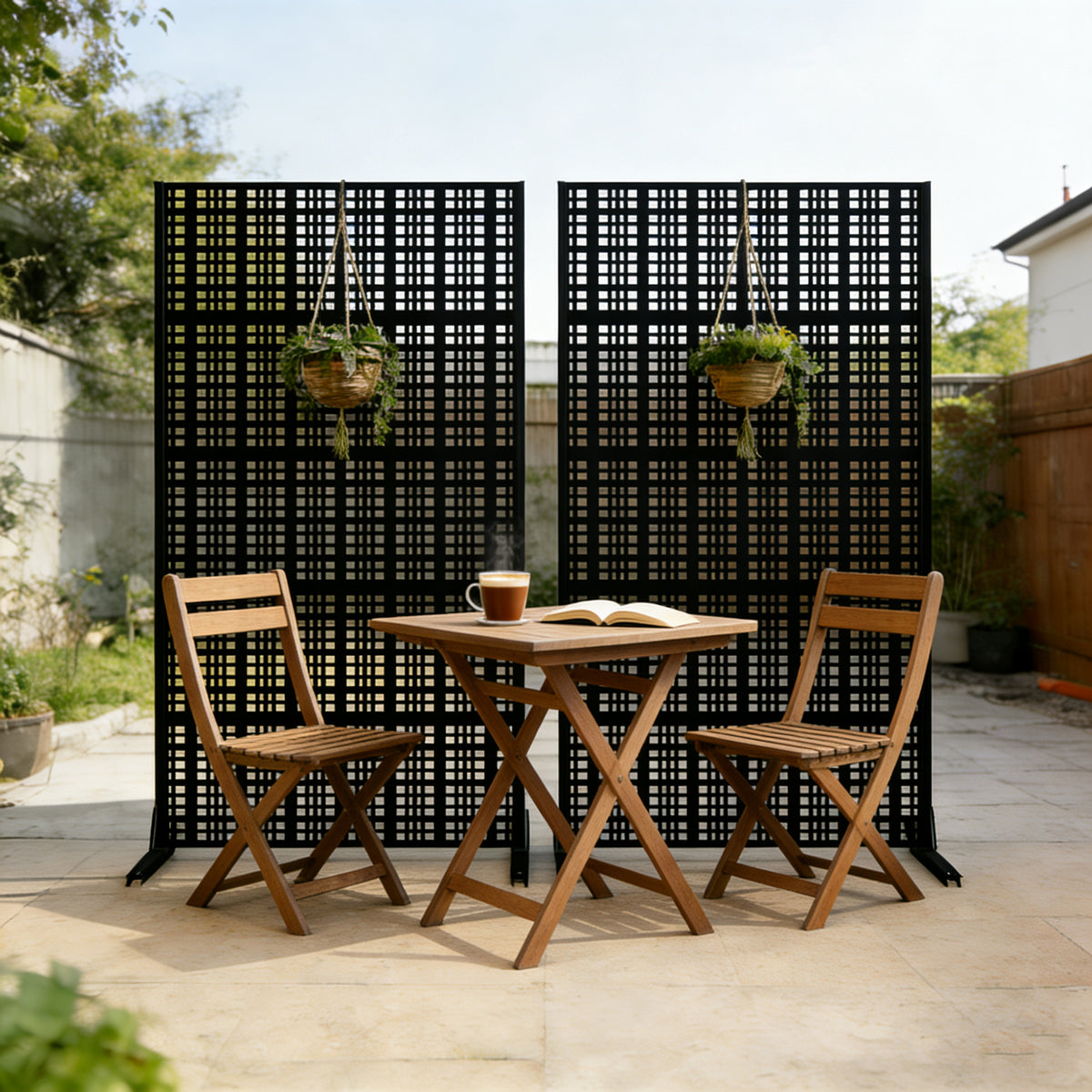 Two metal privacy screen panels placed side by side to create a long garden fence