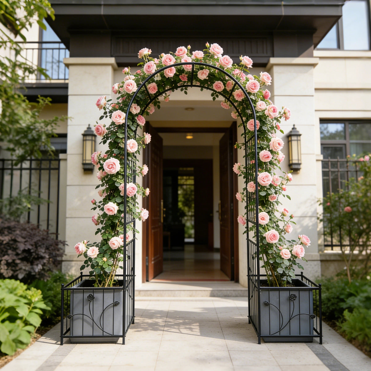 Heavy duty metal garden arch supporting climbing roses and vines in a yard
