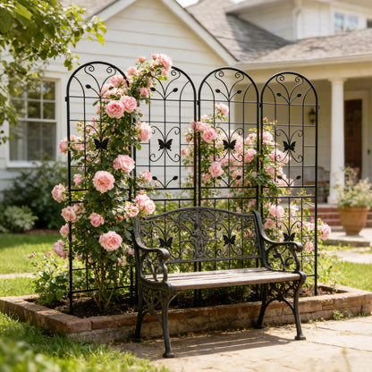 Four metal plant grid panels lined up side by side to form a garden border screen