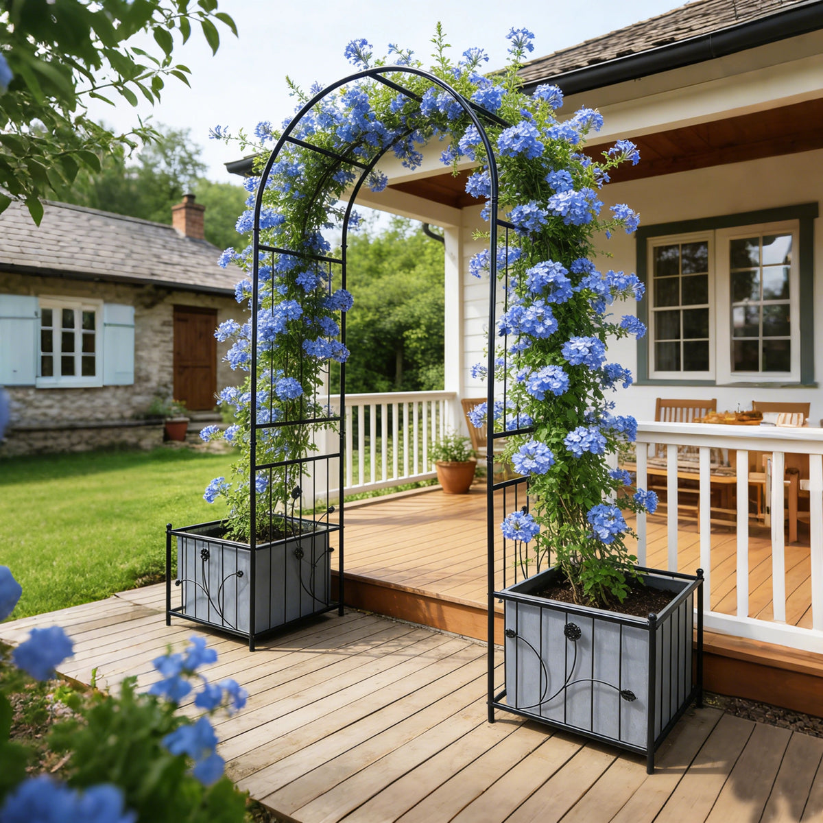 Metal garden arch framing an outdoor bench to create a cozy backyard seating area